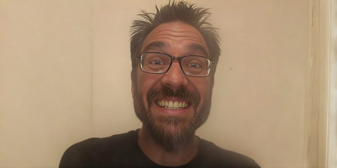 Greg 'Mad Scientist 5150' Nikolettos smiling, showcasing his passionate commitment to revolutionizing supplementation with liposomal technology.