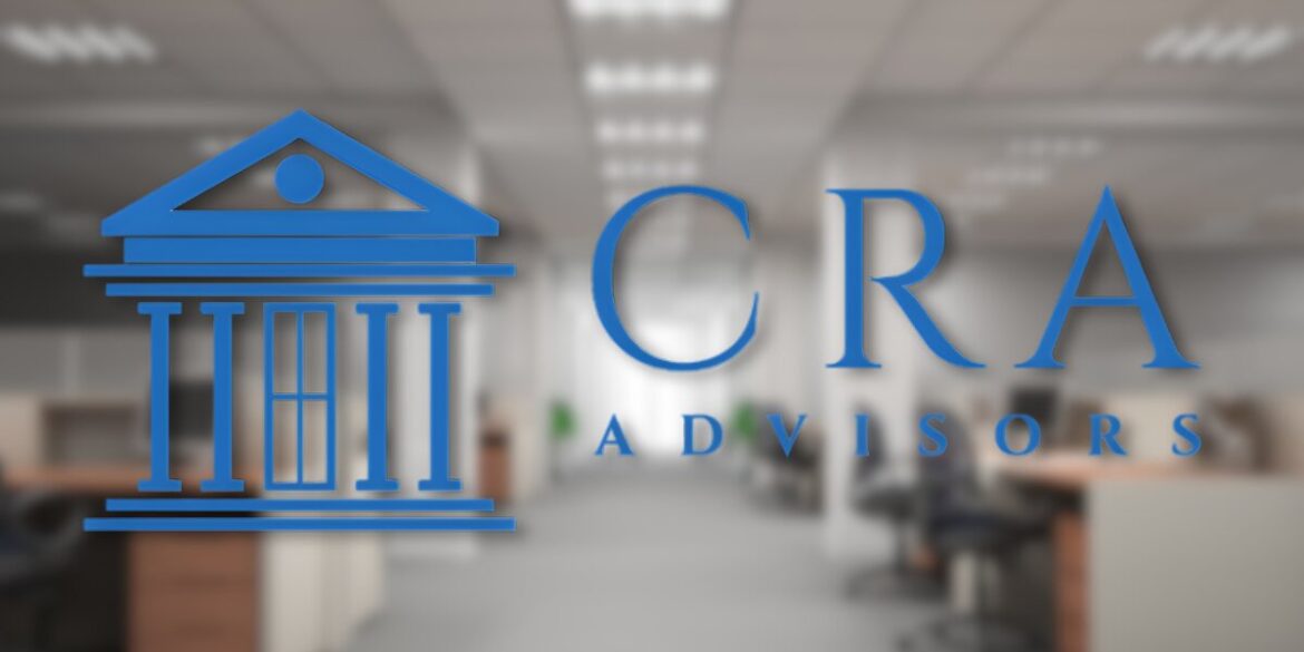 Blurred office background with a prominent blue logo on the left featuring a stylized building, and "CRA Advisors" text in blue on the right.