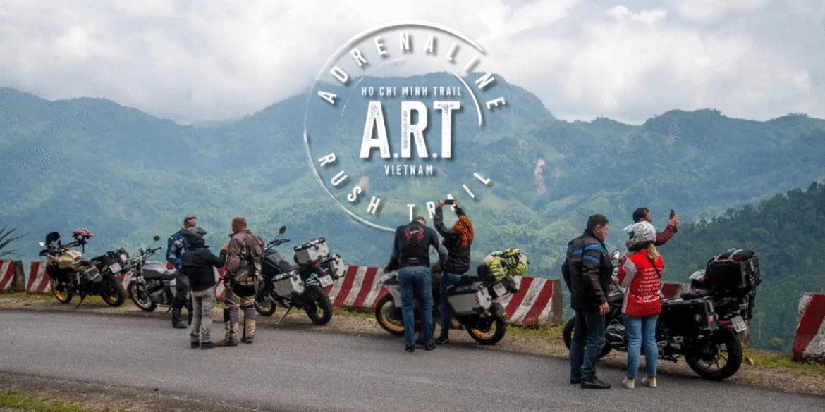 Riders stopping for a break along Vietnam’s Ho Chi Minh Trail with breathtaking mountain views.