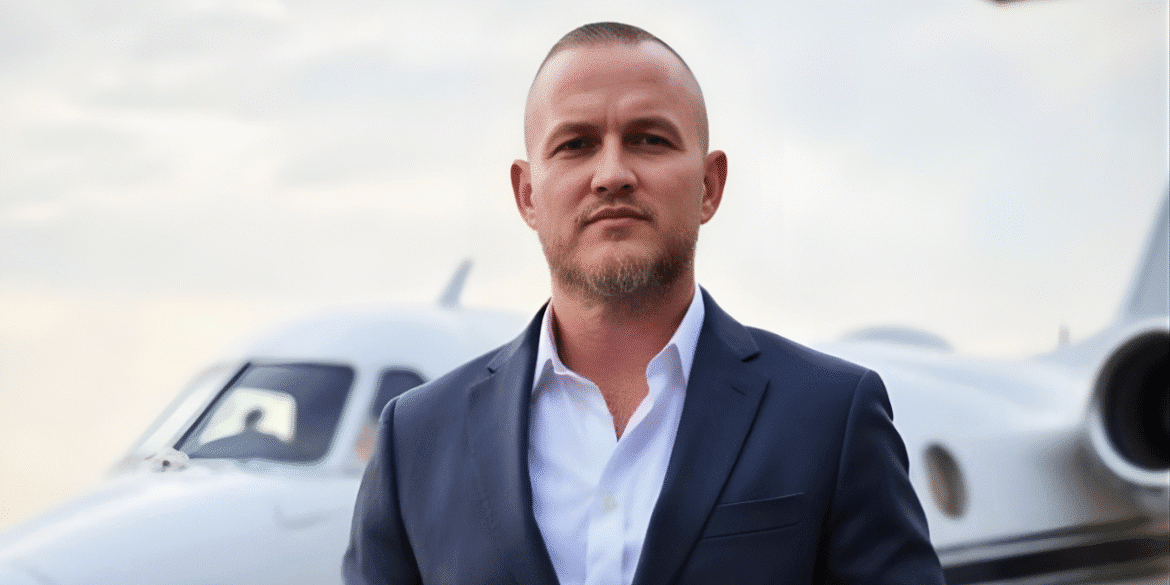 Bryan Wood, founder of Intel2Instagram, standing confidently in front of a private jet, embodying his approach to building authority through strategic social media