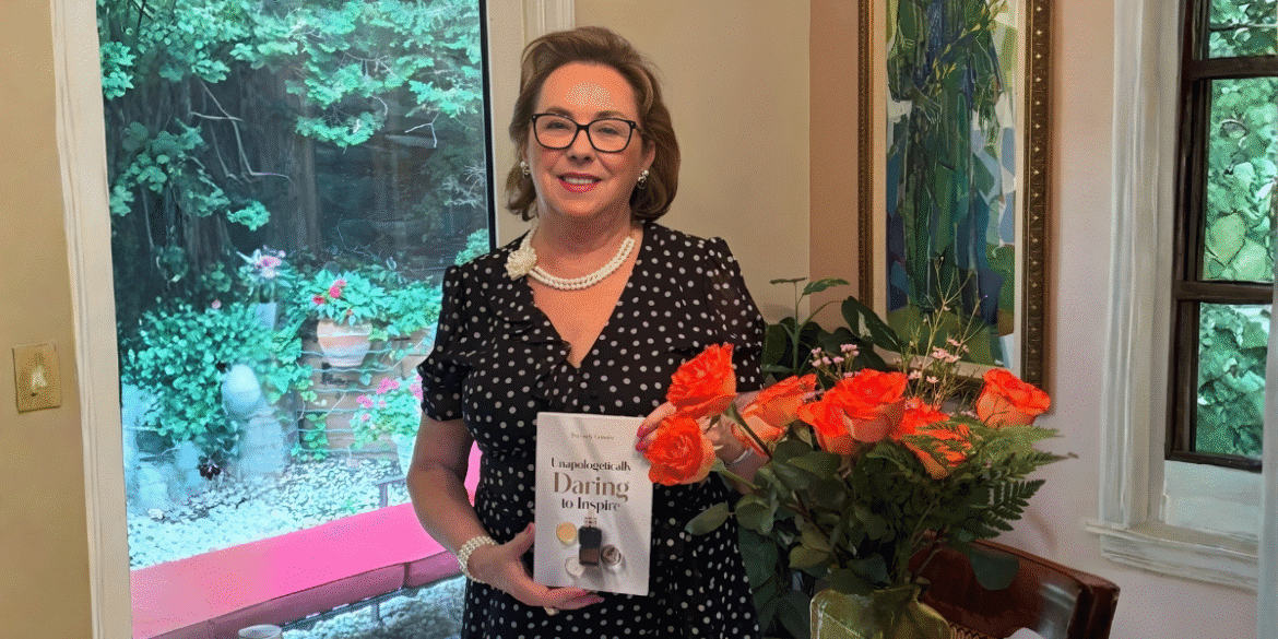 "Petronely Grindea, bestselling author and wellness innovator, holding her memoir 'Unapologetically Daring to Inspire' while promoting women’s empowerment and inner strength."