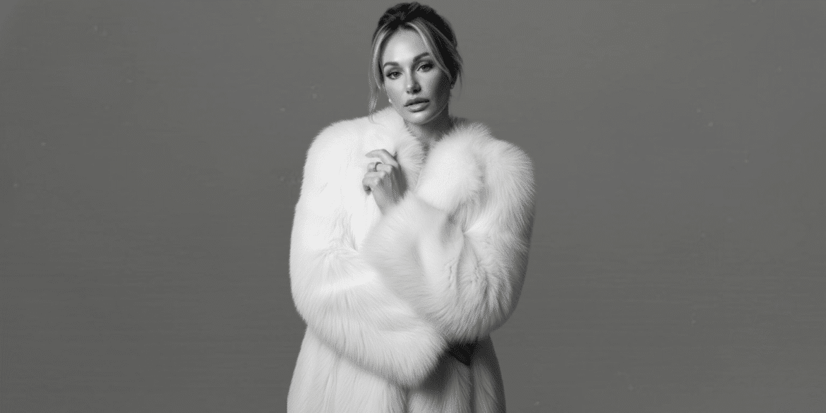 "Natacha Christeler, Master Injector and industry leader, posing elegantly in a chic black suit, embodying precision and artistry in aesthetic medicine."