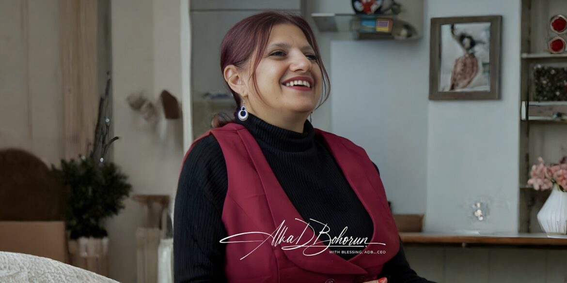 Alka Bohorun smiling in a red vest, embodying the leadership of Bh40 and its global mission to empower communities.