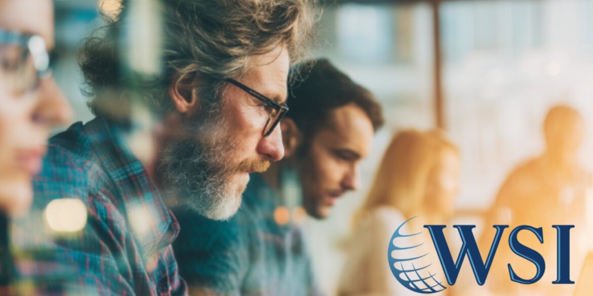 WSI logo displayed on a glass wall, symbolizing AI-driven leadership transformation in business governance and strategy.