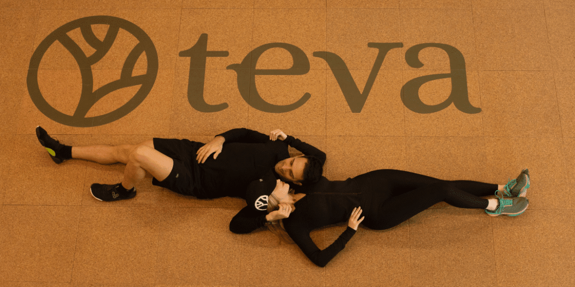 Founders relaxing beneath Teva Wellness logo inside Polanco luxury fitness club, representing integrated training, recovery, community and lifestyle performance hub.