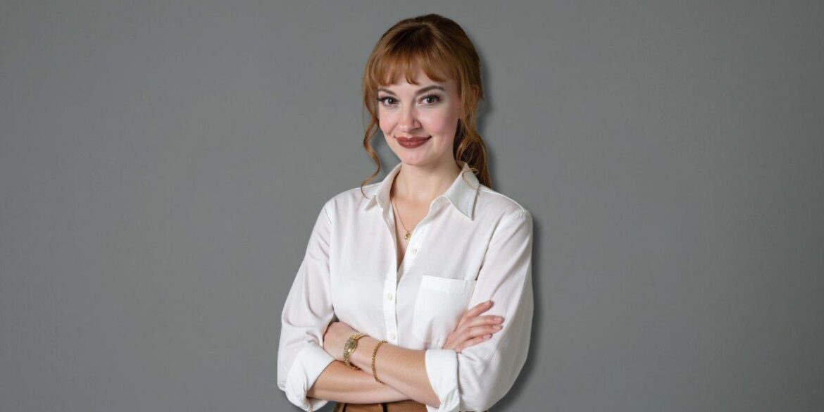A woman wearing a white shirt and brown pants, representing leadership in healthcare innovation and collaboration.