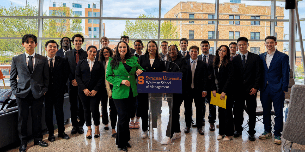 Marie Adornato speaking with Syracuse University Whitman School of Management students at a campus event.