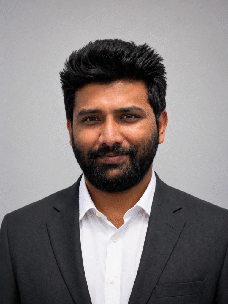 Duvvuru Sravan Kumar Reddy wearing a blue suit and tie in a professional headshot.