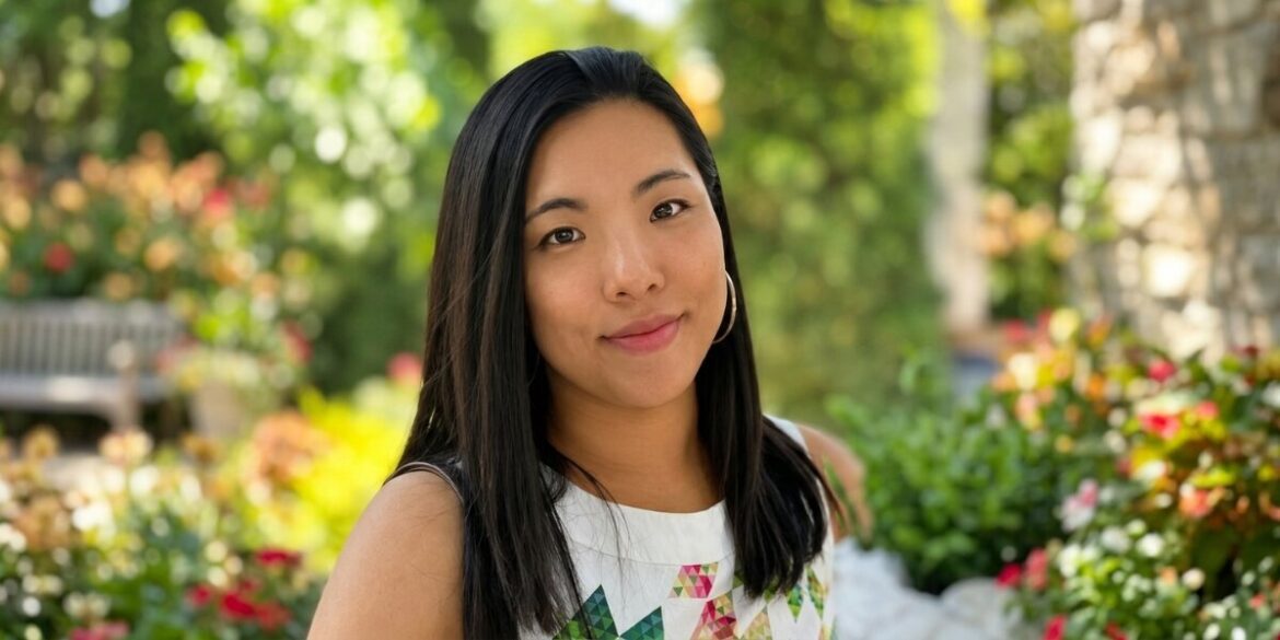 Portrait of HI Connect+ founder Zoe Lau Gungor outdoors in a garden setting.