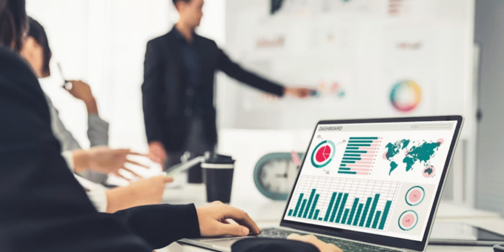 Business team reviewing corporate performance dashboard during an executive meeting.